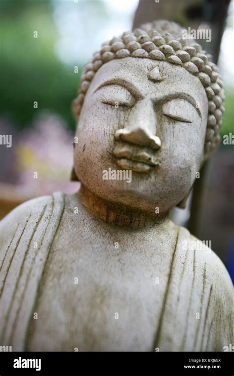 A stone Buddha garden decoration Stock Photo - Alamy