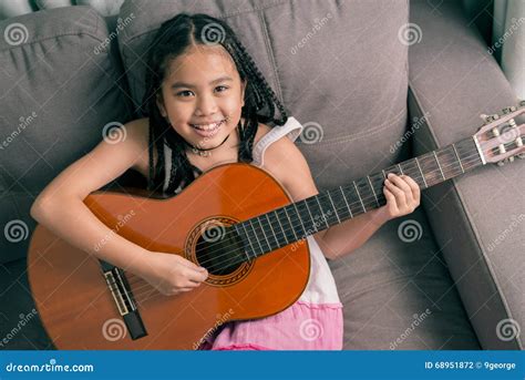 Happy Smiling Girl Learning To Play the Acoustic Guitar Stock Photo - Image of lovely, girl ...