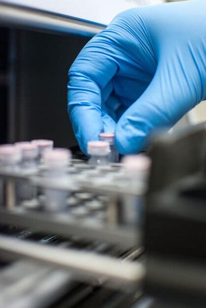 Premium Photo | Scientist working in a laboratory with gloves