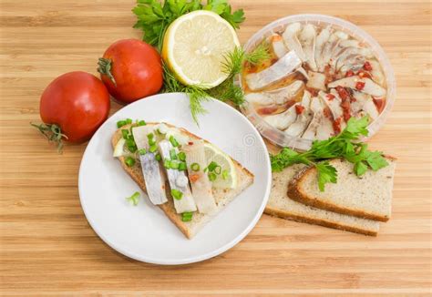 Open Sandwich with Pickled Herring and Ingredients for Its Preparation Stock Photo - Image of ...