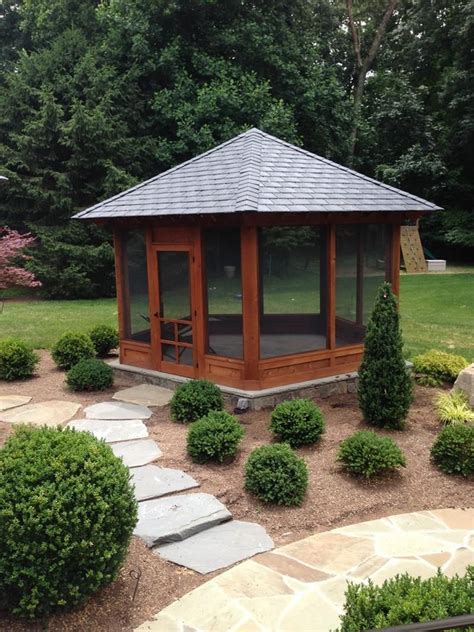 a gazebo in the middle of a garden