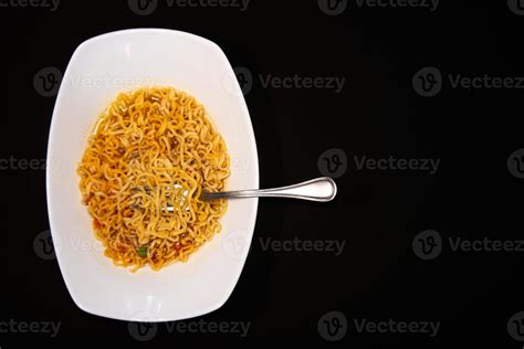 Instant like maruchan soup in white plate on black background 16276099 Stock Photo at Vecteezy