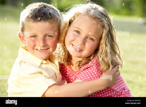 2 Children hugging outdoors Stock Photo - Alamy