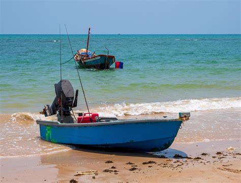 landscape look view Small fishing boat wooden old parked coast the sea. after fishing of ...