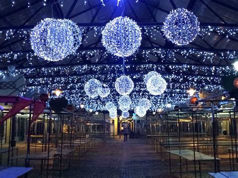 the inside of a building decorated with christmas lights