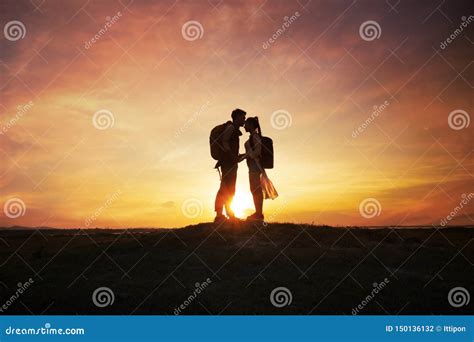 Silhouette Romantic Couple with Sunset or Sunrise Stock Photo - Image of romantic, nature: 150136132