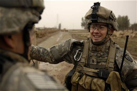 1st Lt. Tyler Patterson talks with one of his soldiers.