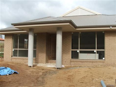 cocoa bricks (2007) with light grey colorbond roof and paperbark ...