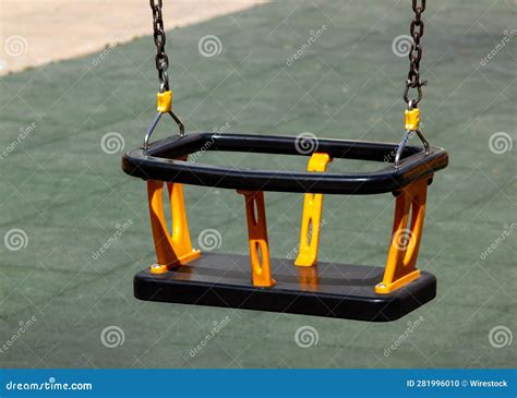 Vibrant and Colorful Playground Swing, Featuring a Plastic Hanging Seat ...