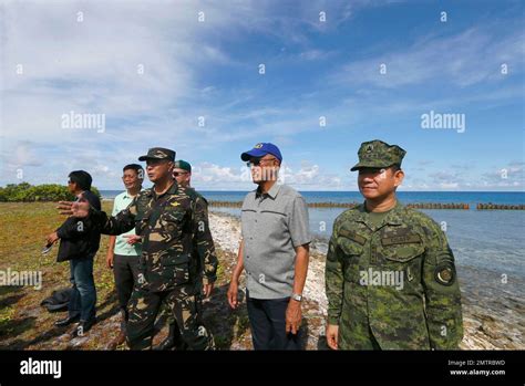 FILE - In this April 21, 2017 file photo, Philippine Defense Chief Delfin Lorenzana, second from ...