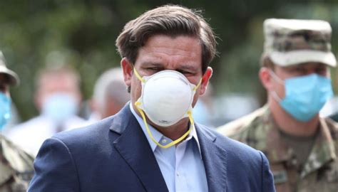 Watch: Florida Governor Ron DeSantis Blunders Putting on Face Mask Amid ...