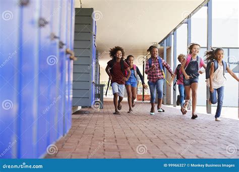 School Kids Running To Camera in Elementary School Hallway Stock Image - Image of bonding ...