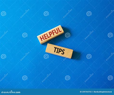 Helpful Tips Symbol. Wooden Blocks with Words Helpful Tips. Beautiful Blue Background. Business ...