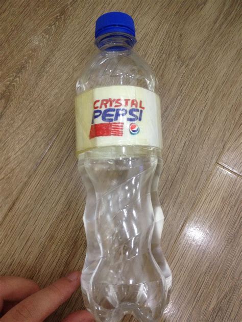 A handmade Crystal Pepsi bottle, based on the original, with duct tape ...