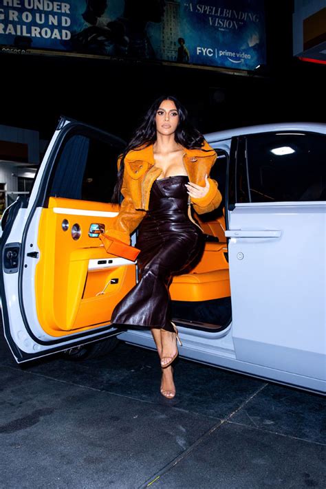 Kim Kardashian Wears Orange Yeezy Jacket Exiting Rolls Royce: Pics – Hollywood Life