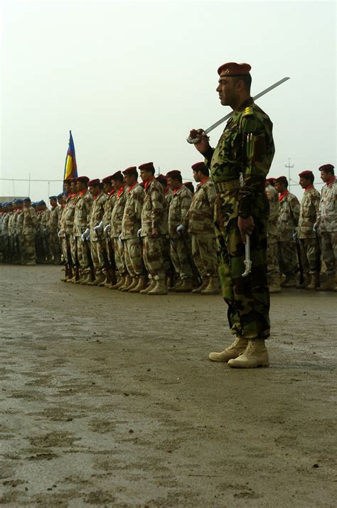 Iraqi Soldiers from the 8th Iraqi Army division await the beginning of Iraqi Army day Jan. 6 ...