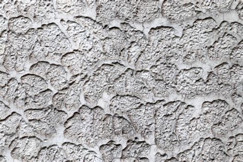 Detailed view on aged concrete walls with cracks and a lot of structure ...