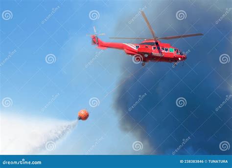 Firefighter Rescue Helicopter with Helitanker Droping Water Stock Photo ...