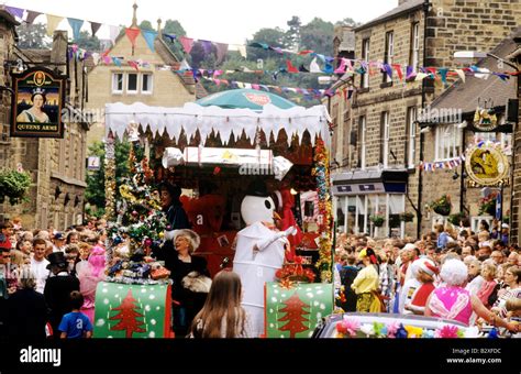 Bakewell Festival annual street carnival Derbyshire decorated floats spectators parade English ...