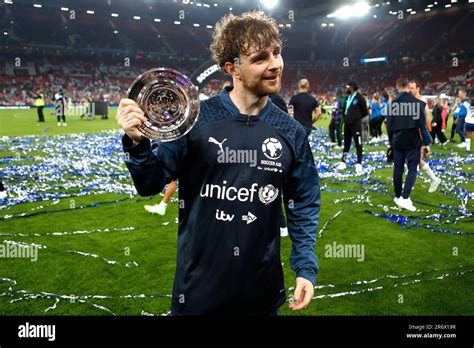 England's Tom Grennan celebrates with the player of the match award ...