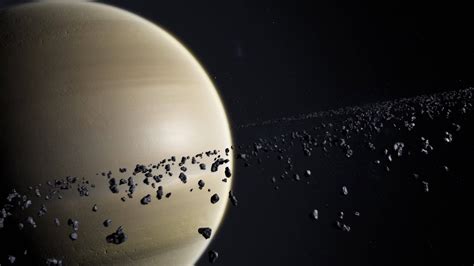 Cinematic Shot of Saturn and asteroids or rocks ring orbiting. Huge planet on dark and starry ...