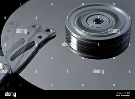 hard disk drive with read write head in motion Stock Photo - Alamy