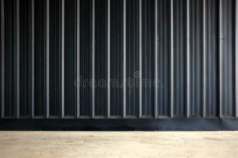 Black Corrugated Metal Wall Texture Background with Concrete Wall .and Light Leak Stock Image ...