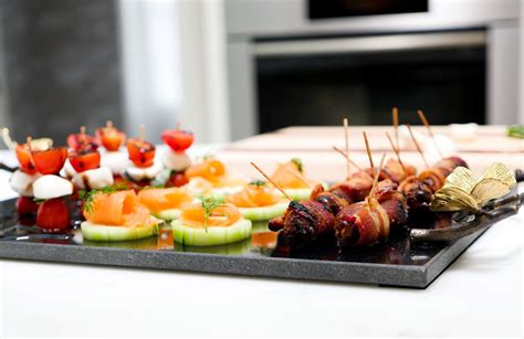 Caprese Salad Bites, Smoked Salmon cucumber disks, and bacon wrapped ...