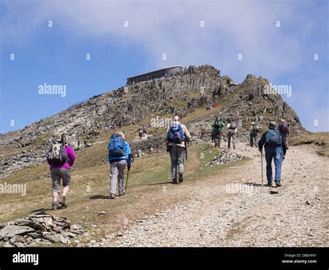 Hikers hiking on Rhyd Ddu path up to Mount Snowdon summit cafe (Hafod ...