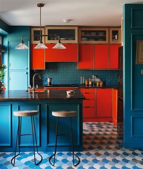 What an unexpected and deep colour combo: rer and teal in the kitchen. Cabaret floor tiles ...