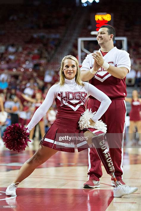 Cheerleaders of the Arkansas Razorbacks perform before a game against ...