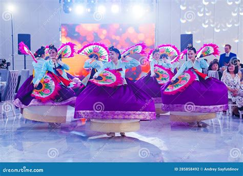 Dancers in National Costumes Dance a Traditional Korean Dance with a ...