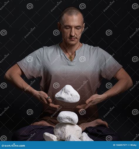 Man Meditating on the Floor in Yoga Pose in Studio Stock Image - Image ...