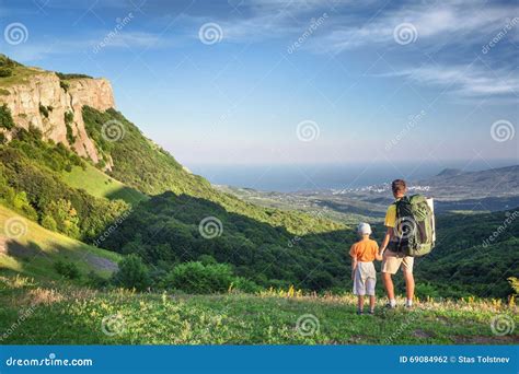 Father and son hiking stock photo. Image of outdoors - 69084962