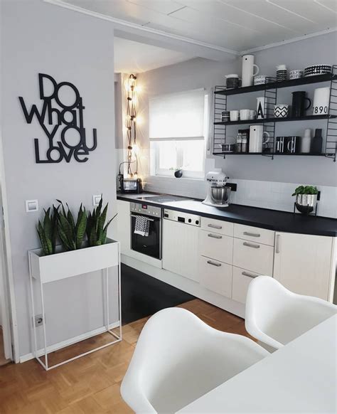 Monochrome kitchens give us all kinds of happy feelings, and this is ...