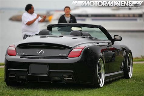 Black Lexus SC430 on Top of Lush Green Field