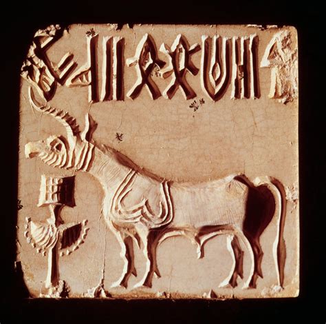 Seal depicting a mythological animal and pictographic symbols, from ...