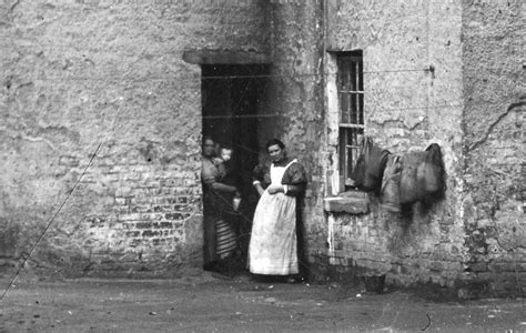 The year is around 1900 and the scene is the front door of Shuttle Row, Blantyre Village works ...