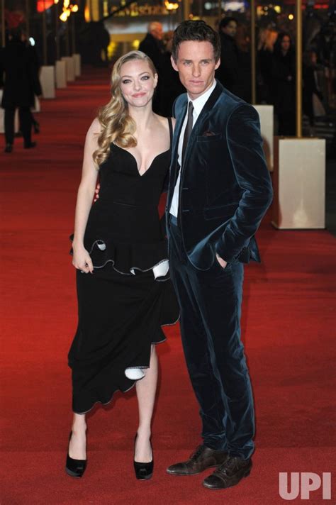 Photo: Amanda Seyfried and Eddie Redmayne attends The World premiere of "Les Miserables" in ...