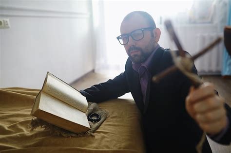 Premium Photo | Man reading and pray from the holy bible near the bed ...