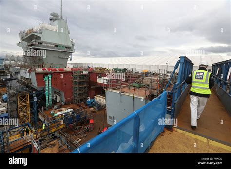 Work continues during a tour of the under-construction aircraft carrier ...