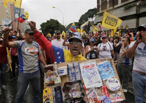 Opposition protesters take to the streets in Venezuela against ...