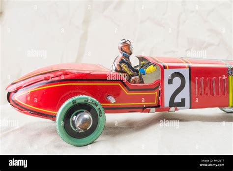 Wind up tin toy race car with driver Stock Photo - Alamy