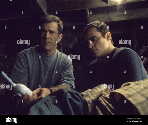 Mel gibson joaquin phoenix signs hi-res stock photography and images ...