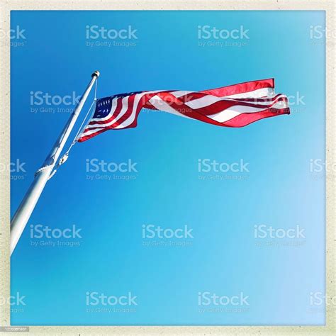 American Flag Flying On Windy Day Stock Photo - Download Image Now ...