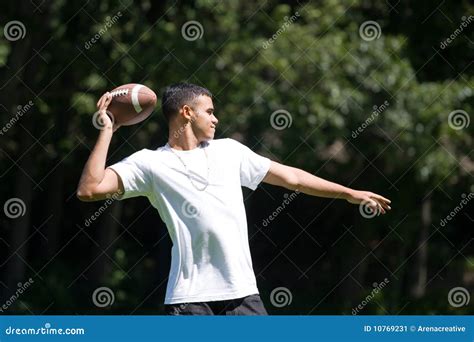 Man Throwing a Football stock image. Image of adult, american - 10769231