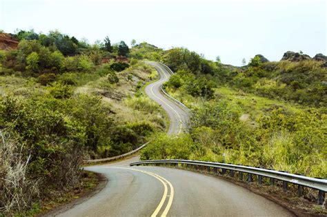 Empty mountain road against sky stock photo