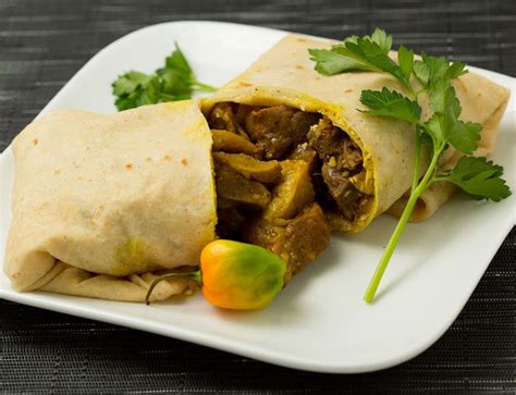 jamaican curry goat roti | curry goat roti our house made curried goat bone in wrapped in a warm ...