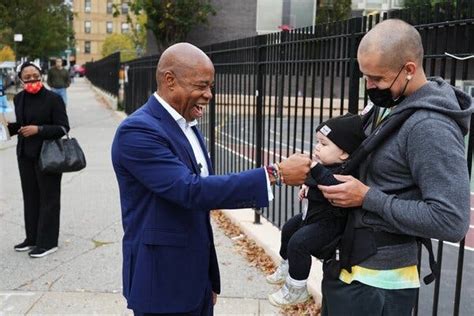 Eric Adams was emotional after casting his ballot, carrying a photo of ...