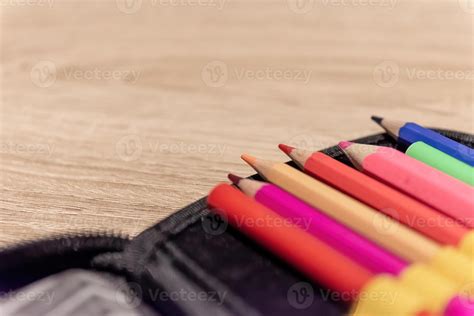 colored pencils in a pencil box 13950913 Stock Photo at Vecteezy